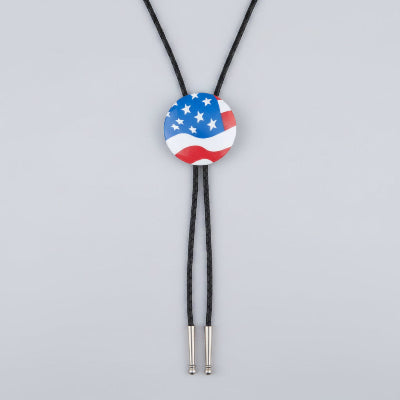 Bolo tie with American flag design on a gray background